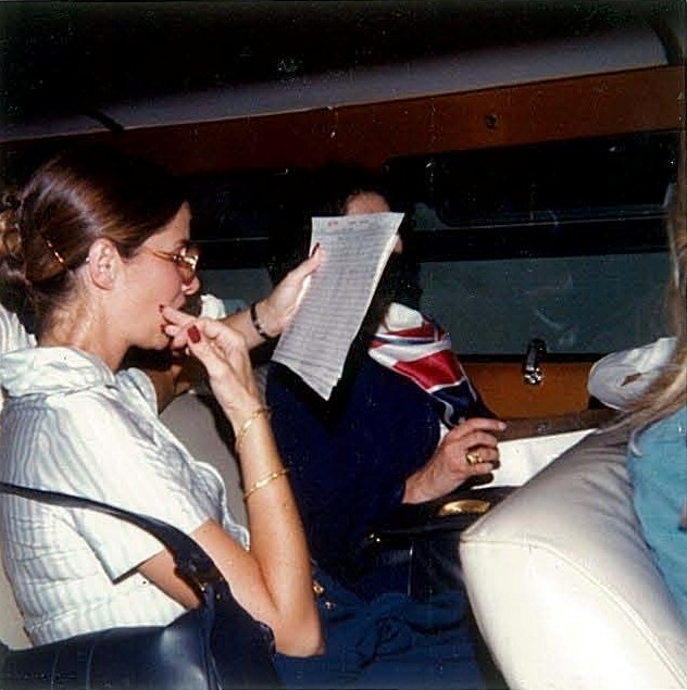 1970s Pan Am flight attendants relax and read in the hotel crew van after arrival on Guam